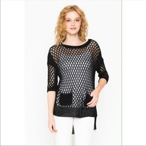 Crochet net top with hi-low hem.